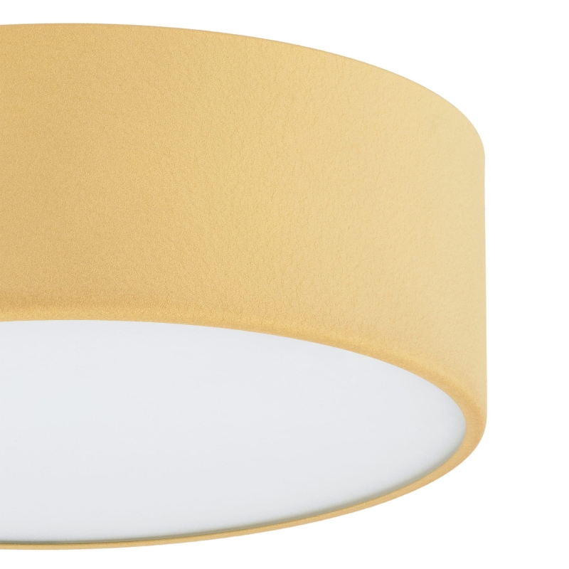 Mały złoty plafon okrągły z metalu o średnicy 25 cm w formie lampy sufitowej - detal.