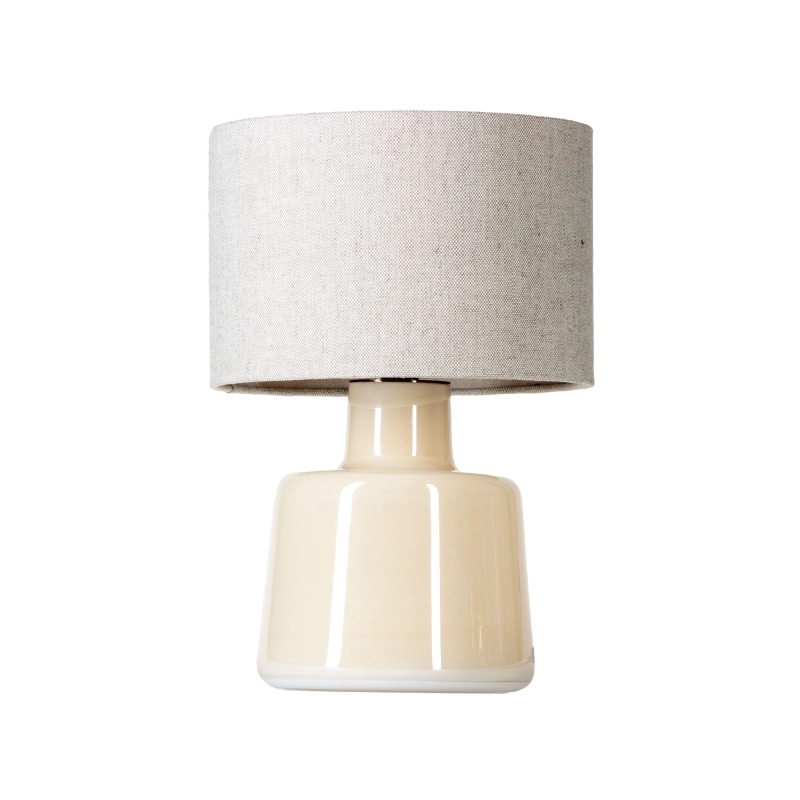 Kremowa lampa stołowa szklana SANTANA CREAM w białym kolorze z błyszczącą, waniliową powłoką z lnianym abażurem w kształcie walca.